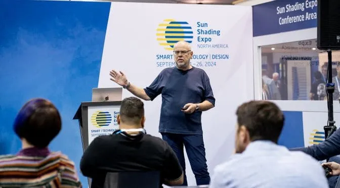 Speaker presenting on the branded conference stage