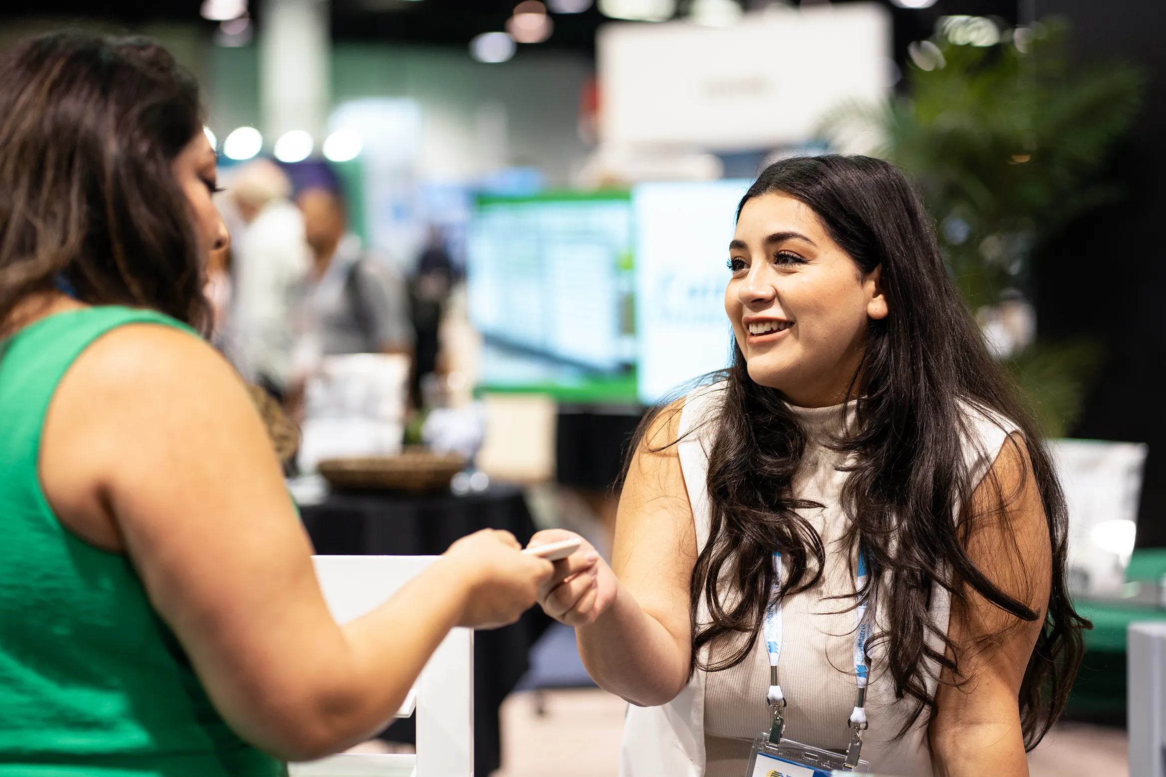 Industry professionals networking on the show floor